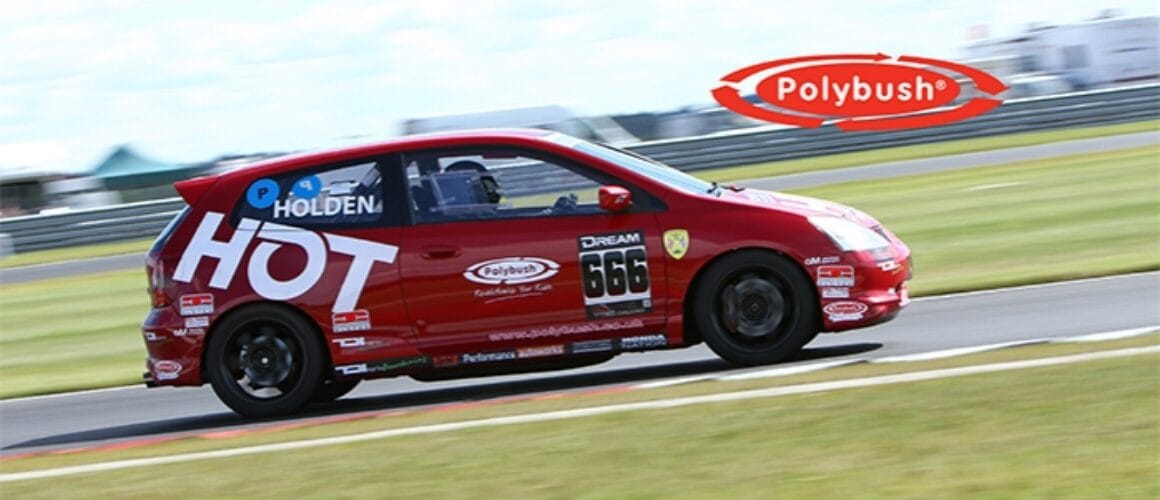 A red Vauxhall racing car with number 666 and multiple sponsor logos, including "polybush," speeding on a racetrack with a clear blue sky in the background.