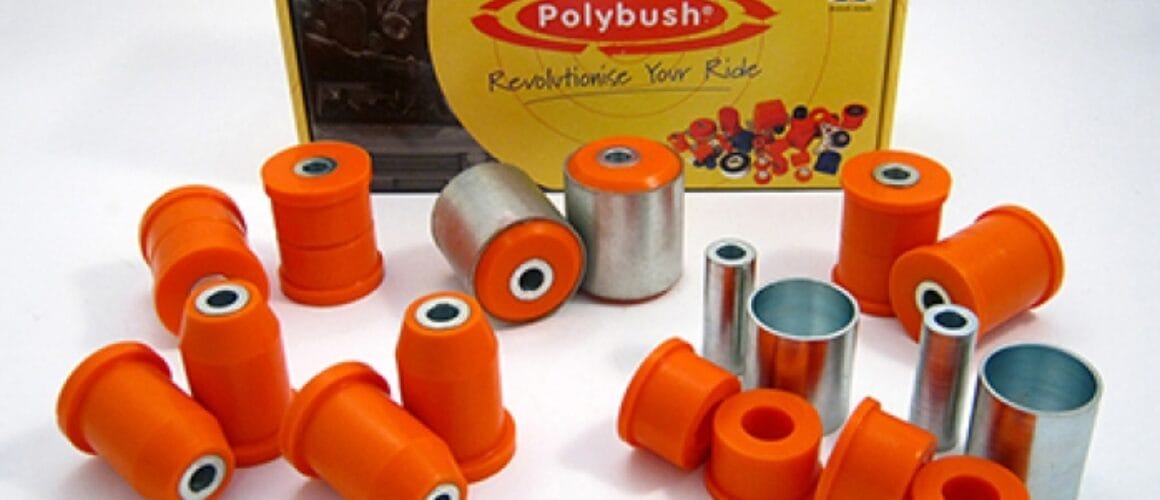 A collection of orange polybush car suspension bushings and metal parts displayed in front of their packaging box with the UK flag and the text "revolutionise your ride". 

Since both texts are in English, there isn't any translation to be made. However, re-phrasing to sound more British can be considered a form of "translation":

A collection of orange polybush vehicle suspension bushings and metal components proudly presented in front of their packaging box, adorned with the UK flag and emblazoned with the text "revolutionise your drive".