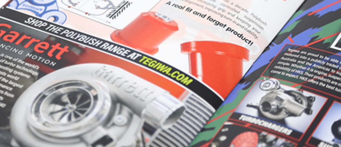 Open magazine showcasing various car parts including a turbocharger, lubricant sprays, and other car accessories. The pages are glossy and feature vibrant images with text descriptions.