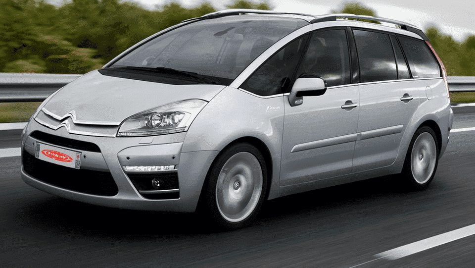 A silver citroën picasso people carrier on a motorway, displaying motion blur on the road to suggest speed, under a cloudy sky.